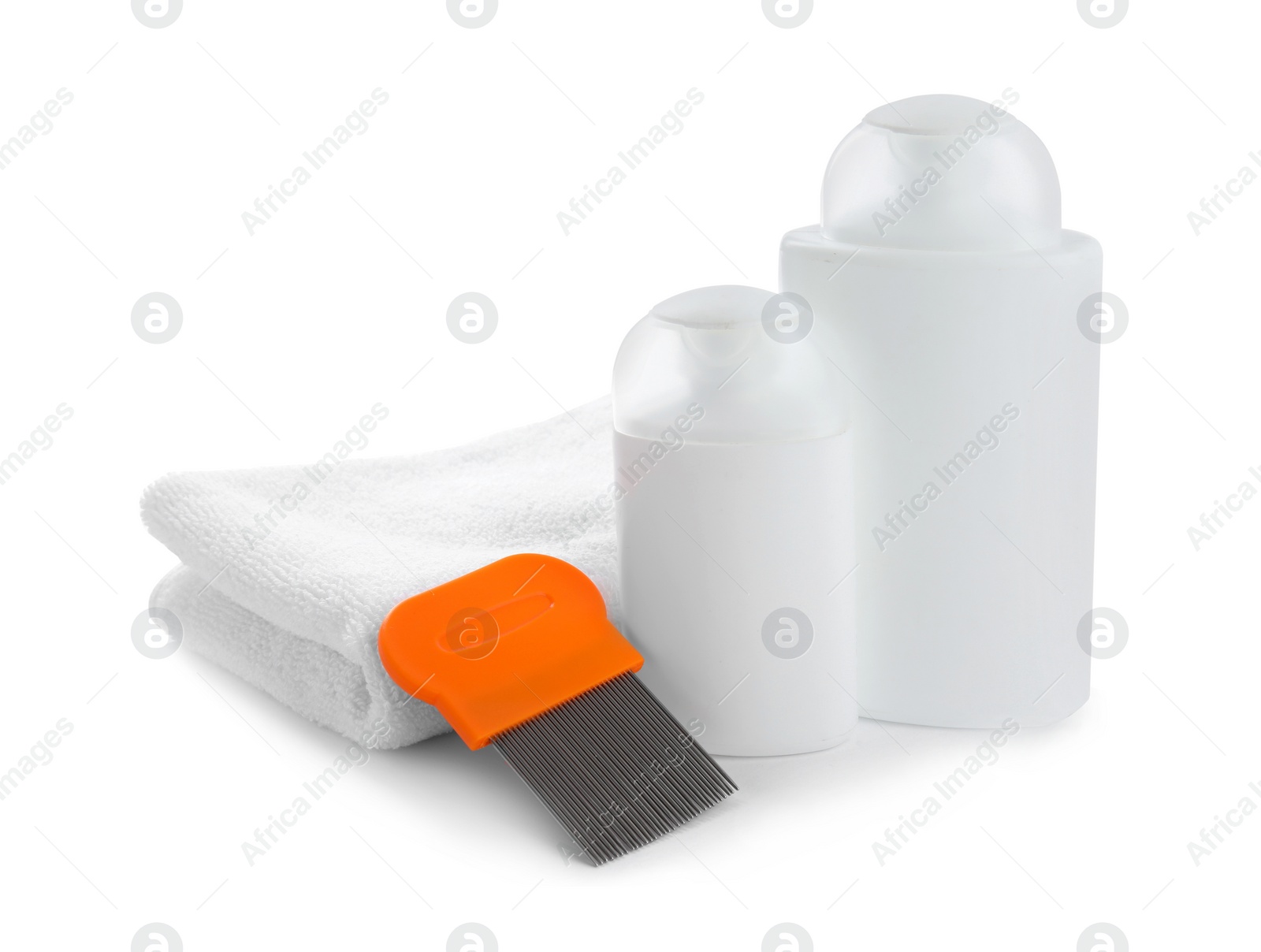 Photo of Products for anti lice treatment, metal comb and towel on white background