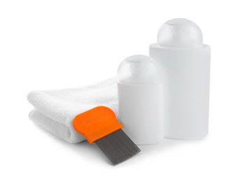 Photo of Products for anti lice treatment, metal comb and towel on white background
