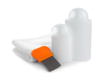 Products for anti lice treatment, metal comb and towel on white background