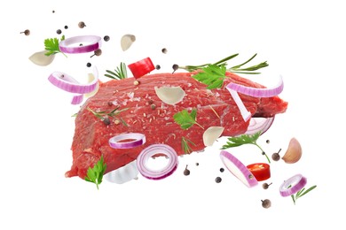 Fresh raw meat and different spices flying on white background