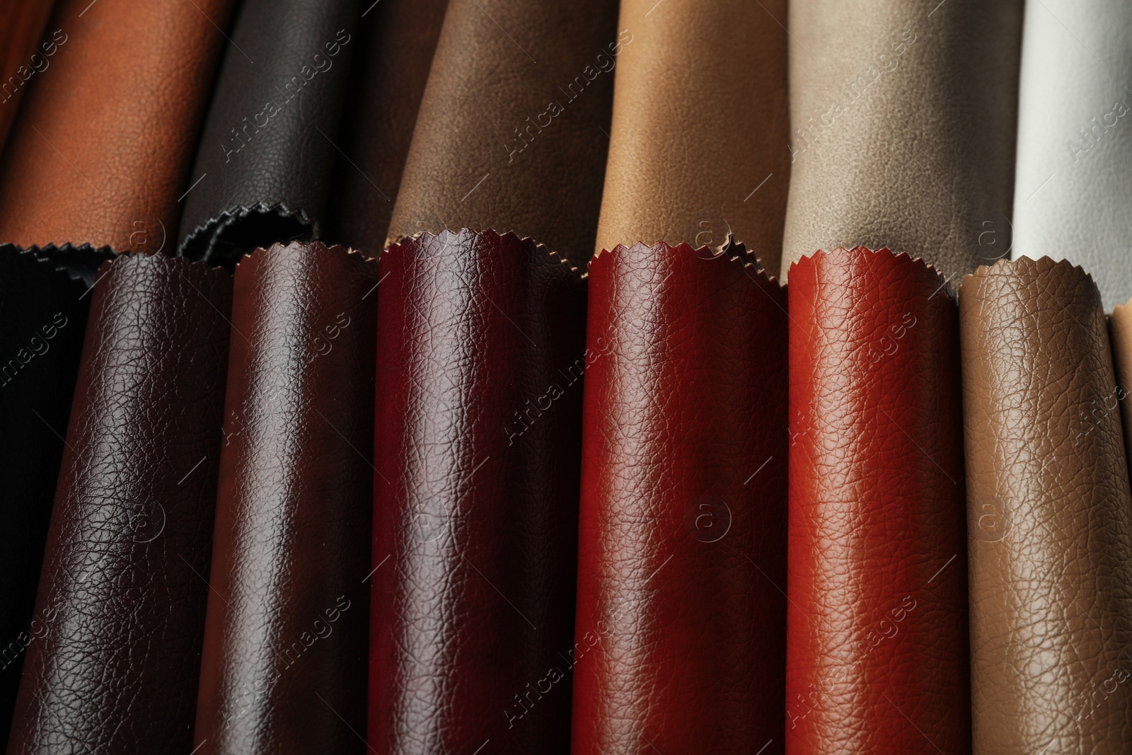 Photo of Different leather samples as background, closeup view