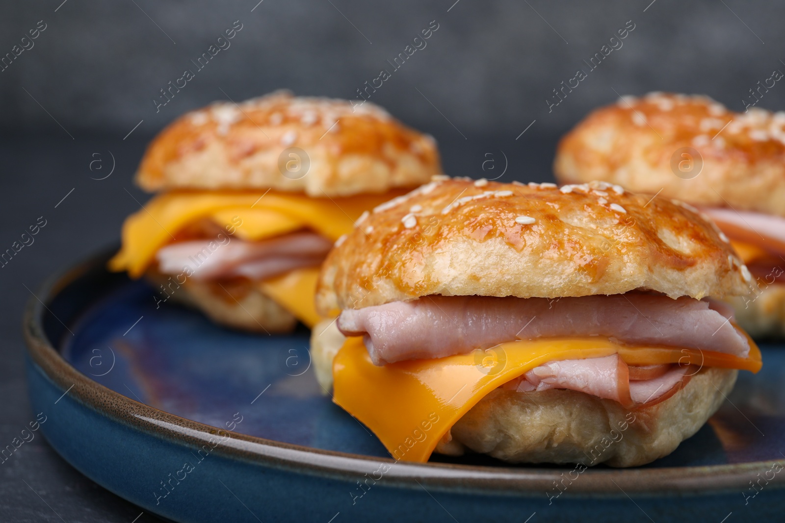 Delicious bagels with ham and cheese on table, closeup Photo of Delicious bagels with ham and cheese on table, closeup