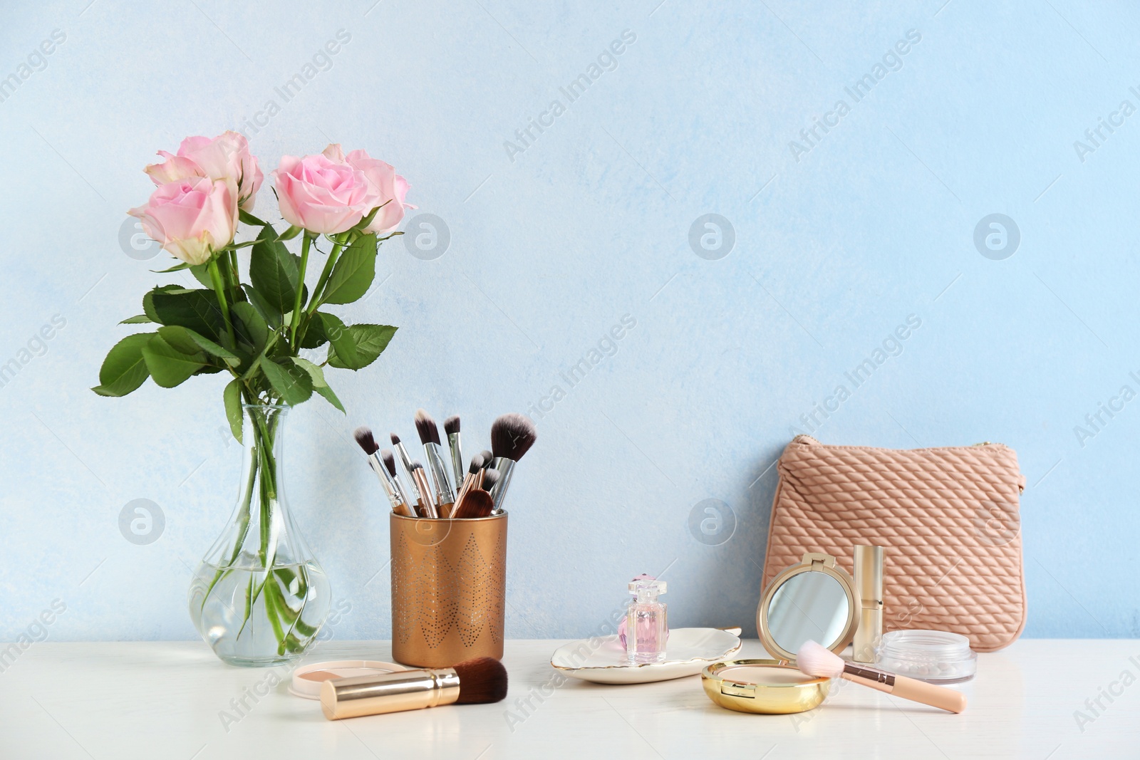 Photo of Dressing table with beauty accessories in room. Space for text