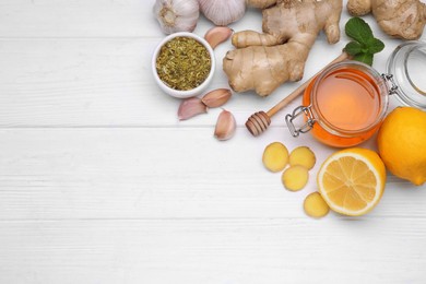 Photo of Different natural cold remedies on white wooden table, flat lay with space for text. Cough treatment