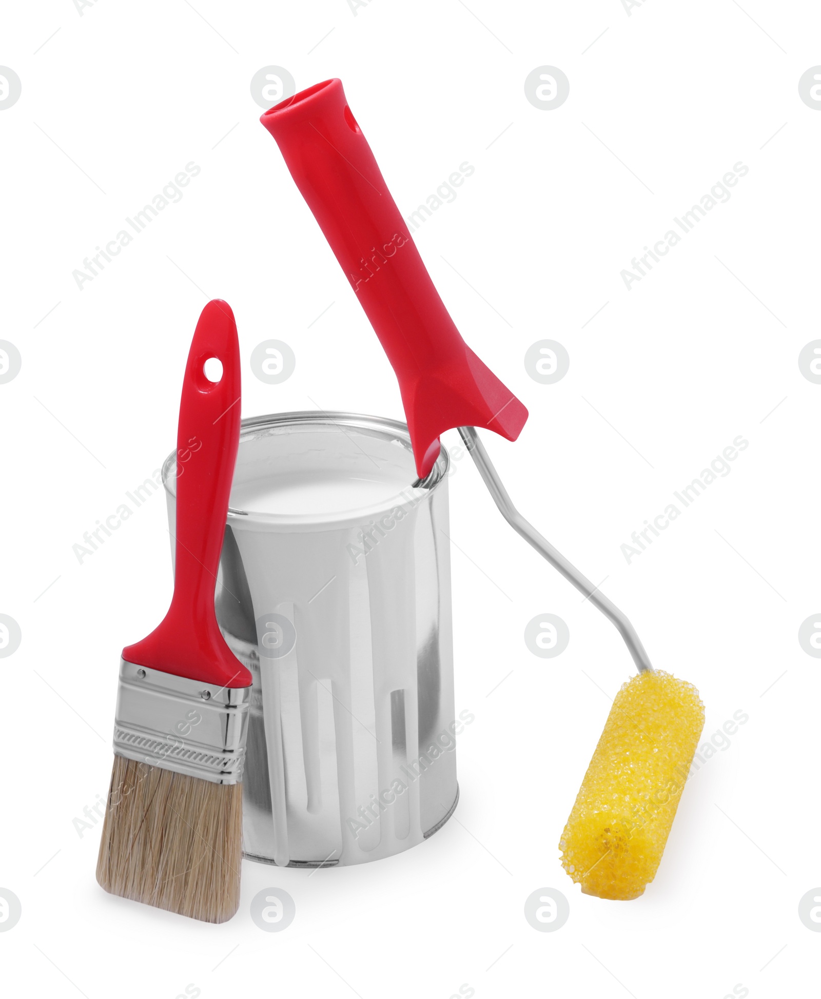 Photo of Can of white paint, roller and brush isolated on white