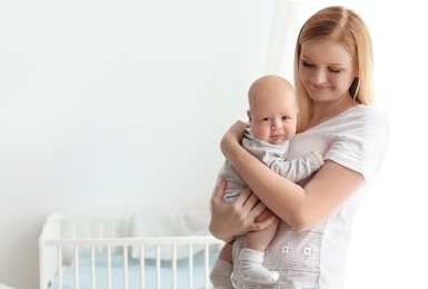 Happy mother and her baby at home