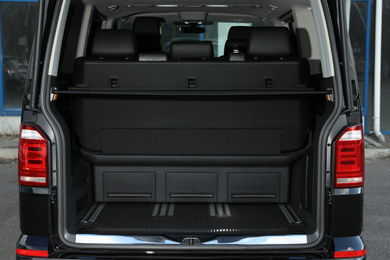Photo of Modern car with open empty trunk outdoors