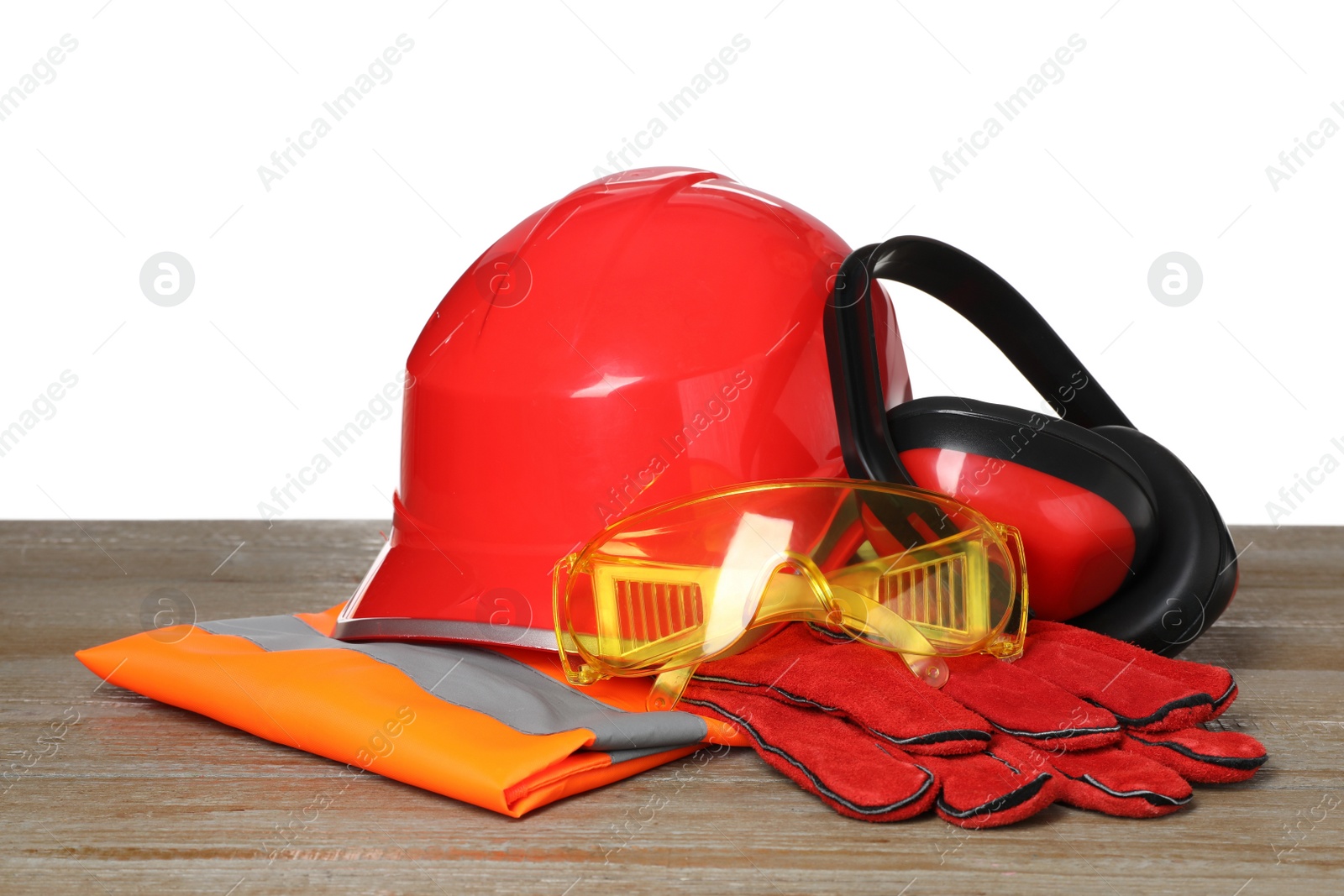 Photo of Personal protective equipment on wooden surface against white background