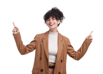 Photo of Beautiful happy businesswoman pointing at something on white background