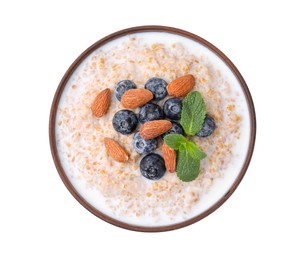 Photo of Tasty wheat porridge with milk, blueberries and almonds in bowl isolated on white, top view