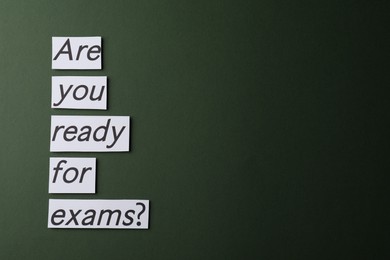 Photo of Notes with words Are you ready for exams on dark green background, space for text