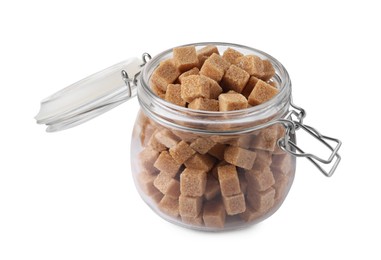 Photo of Glass jar of brown sugar cubes isolated on white