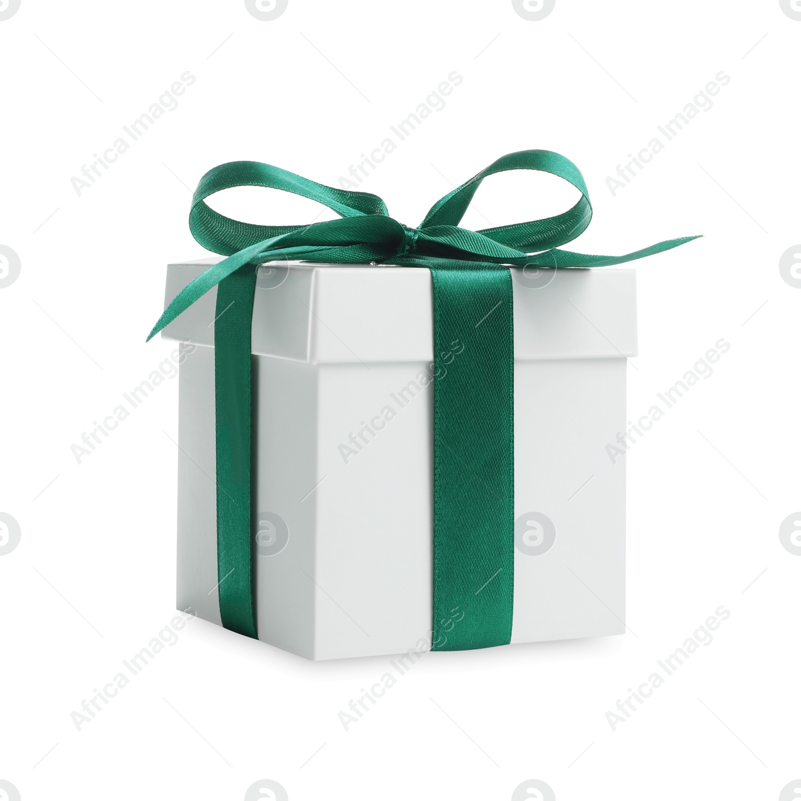 Photo of Christmas gift. Box with green ribbon bow on white background