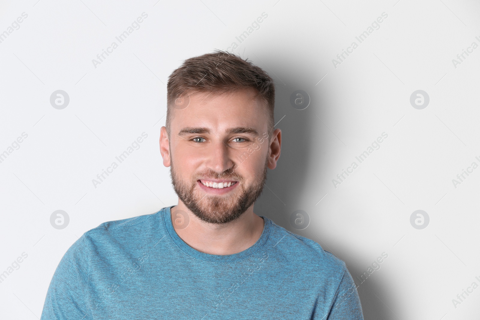 Photo of Portrait of handsome happy man on white background