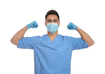 Doctor with protective mask showing muscles on white background. Strong immunity concept