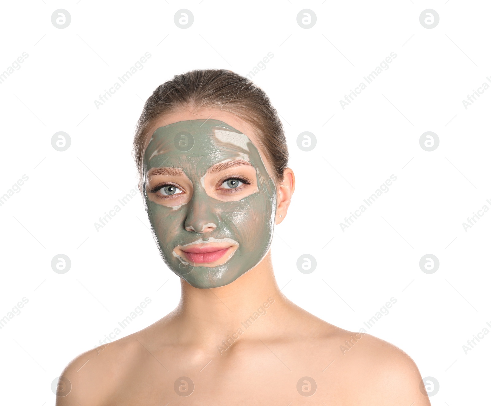 Photo of Beautiful woman with clay mask on her face against white background