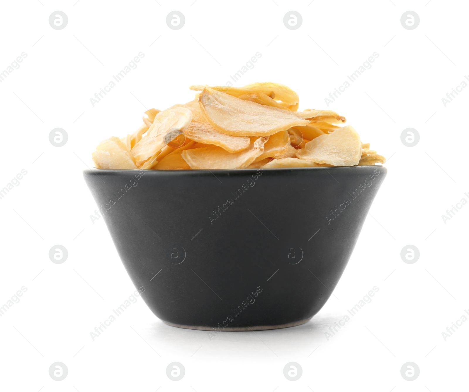 Photo of Dried garlic flakes in bowl on white background