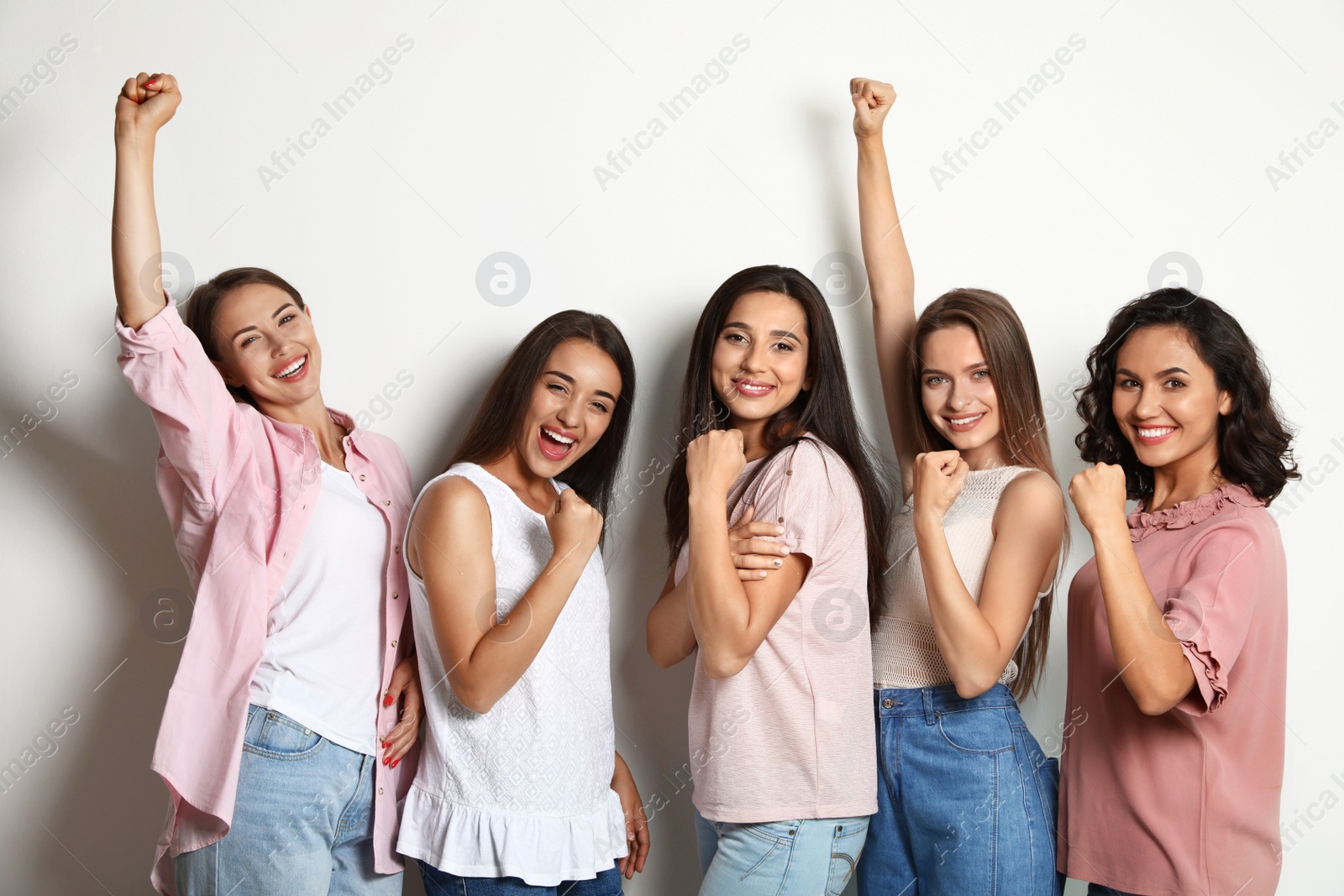 Photo of Happy women on white background. Girl power concept