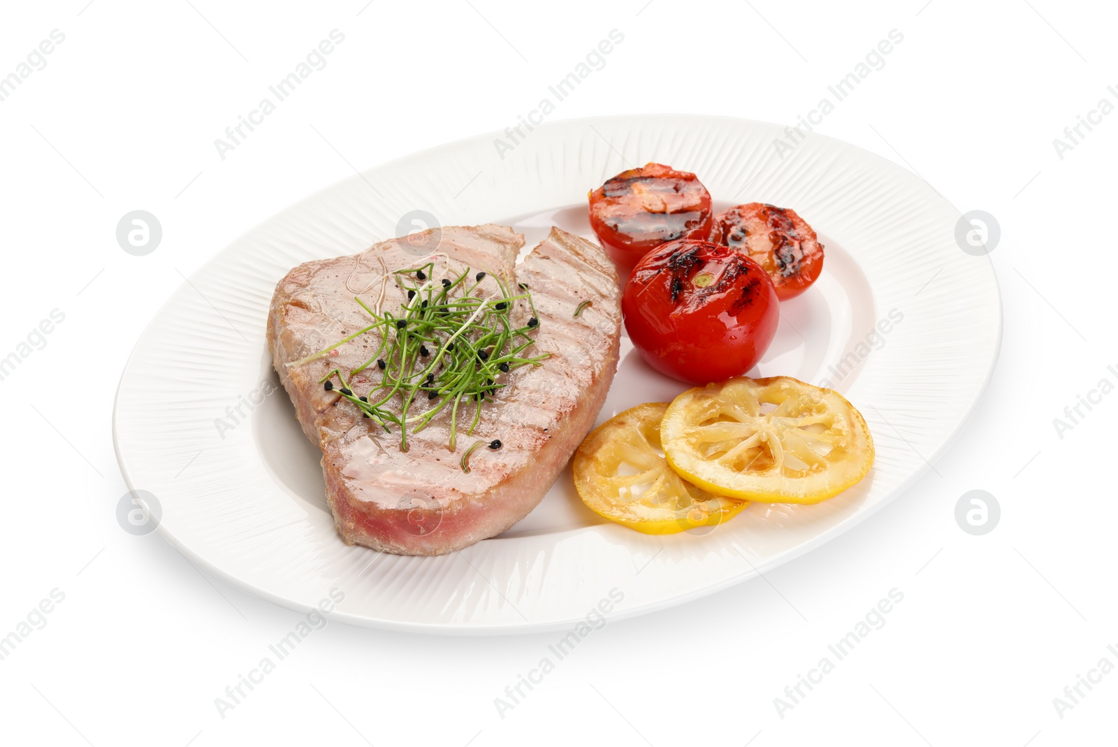 Photo of Delicious tuna steak with tomatoes and lemon isolated on white