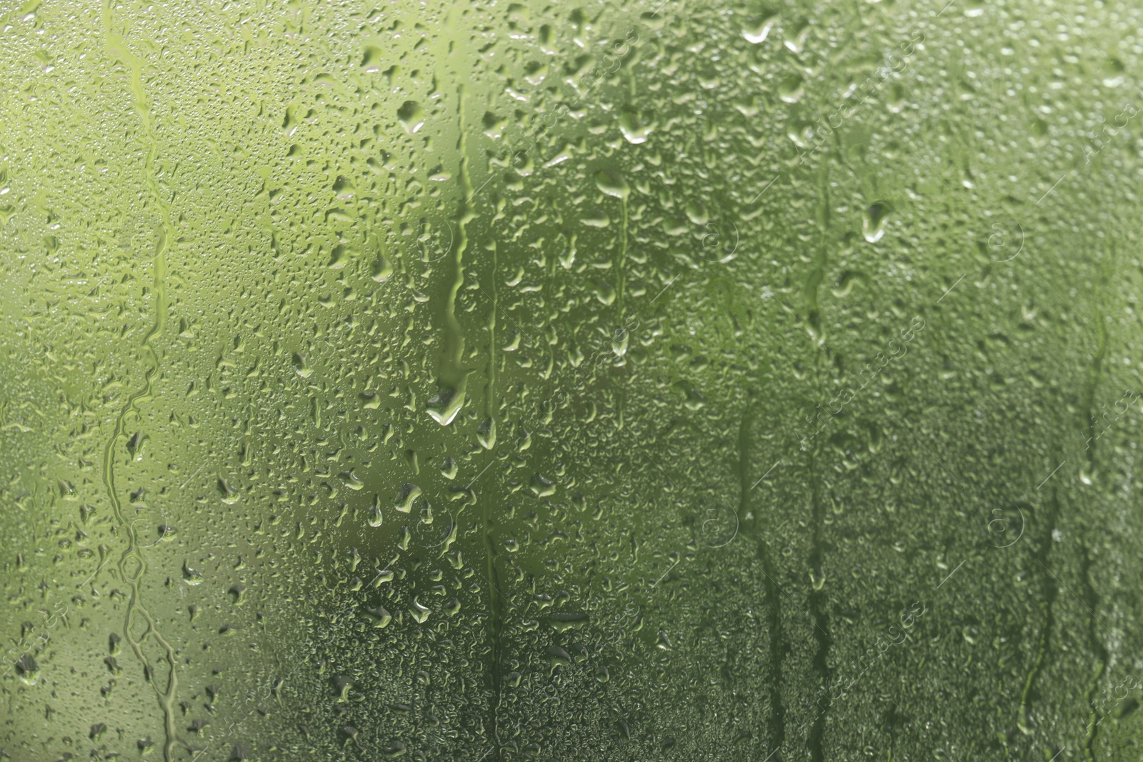 Photo of Window glass with raindrops as background, closeup