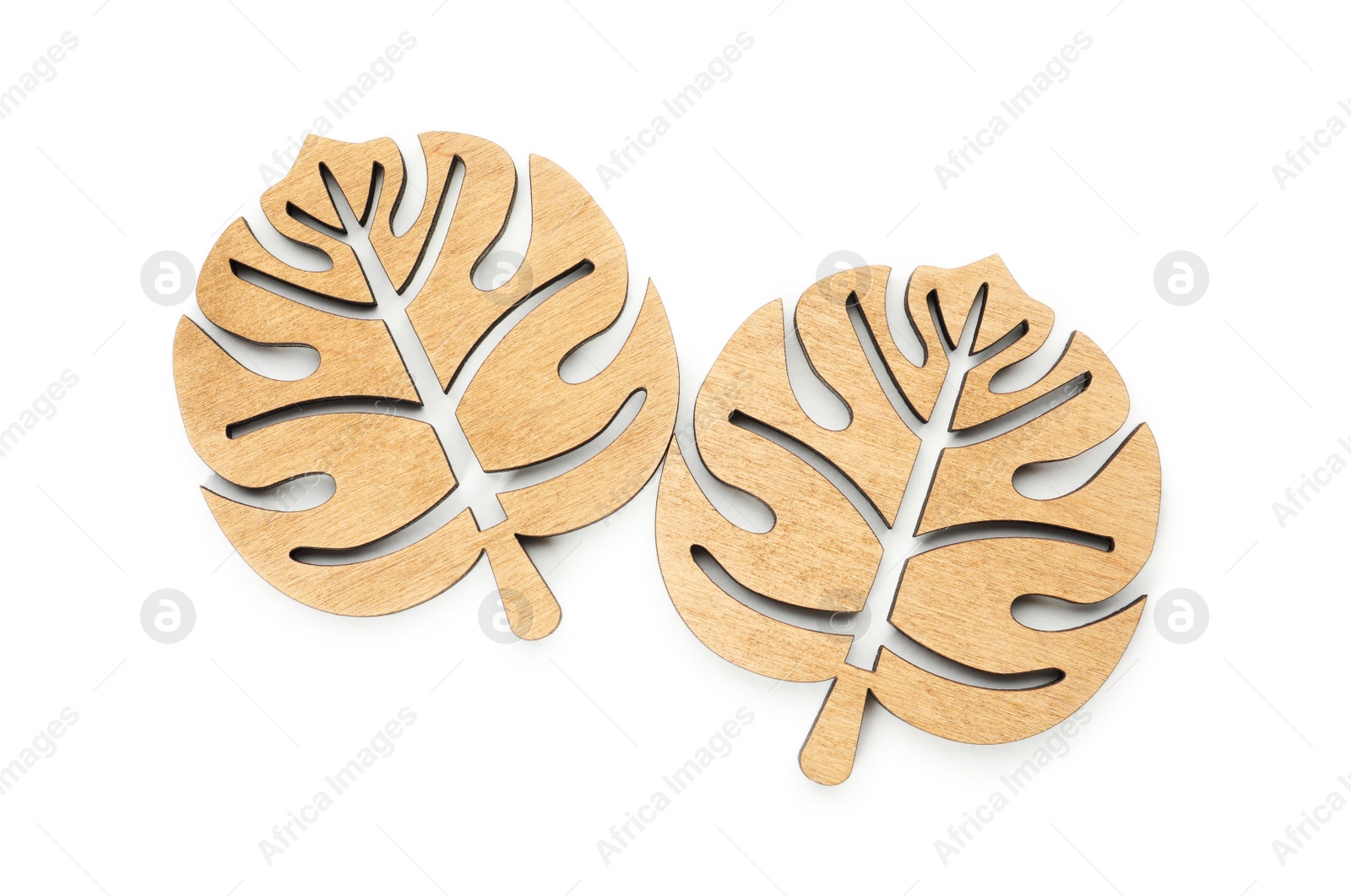 Photo of Leaf shaped wooden cup coasters on white background, top view