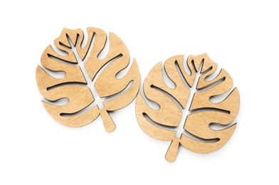 Leaf shaped wooden cup coasters on white background, top view