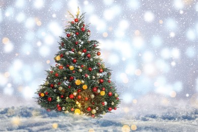 Image of Beautifully decorated Christmas tree on blurred background. Bokeh effect