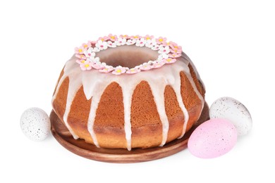 Photo of Festively decorated Easter cake and painted eggs on white background