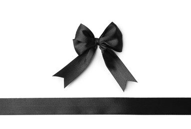 Black satin ribbon with bow isolated on white, top view