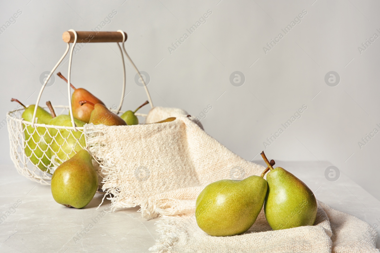 Photo of Composition with tasty ripe pears on table