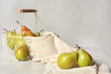 Composition with tasty ripe pears on table