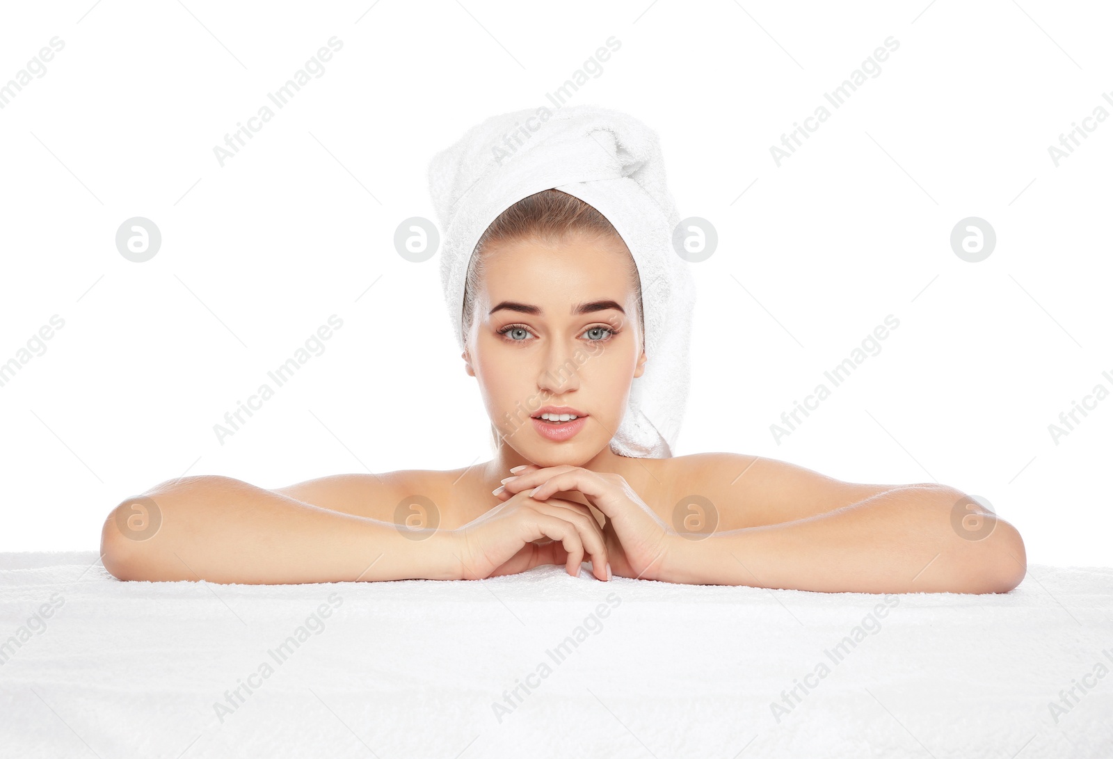 Photo of Portrait of young pretty woman with towel on white background