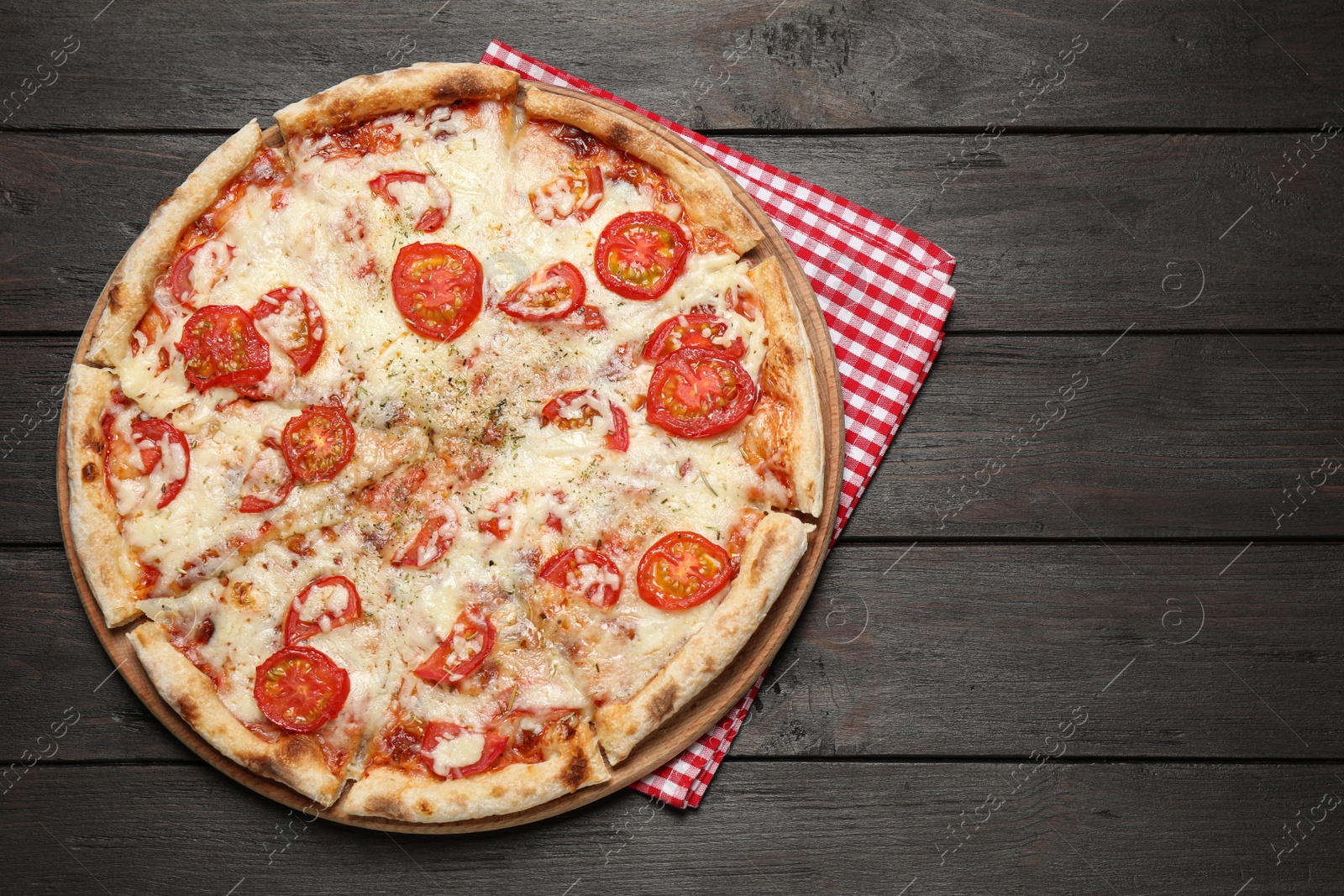 Photo of Delicious pizza Margherita on wooden table, top view