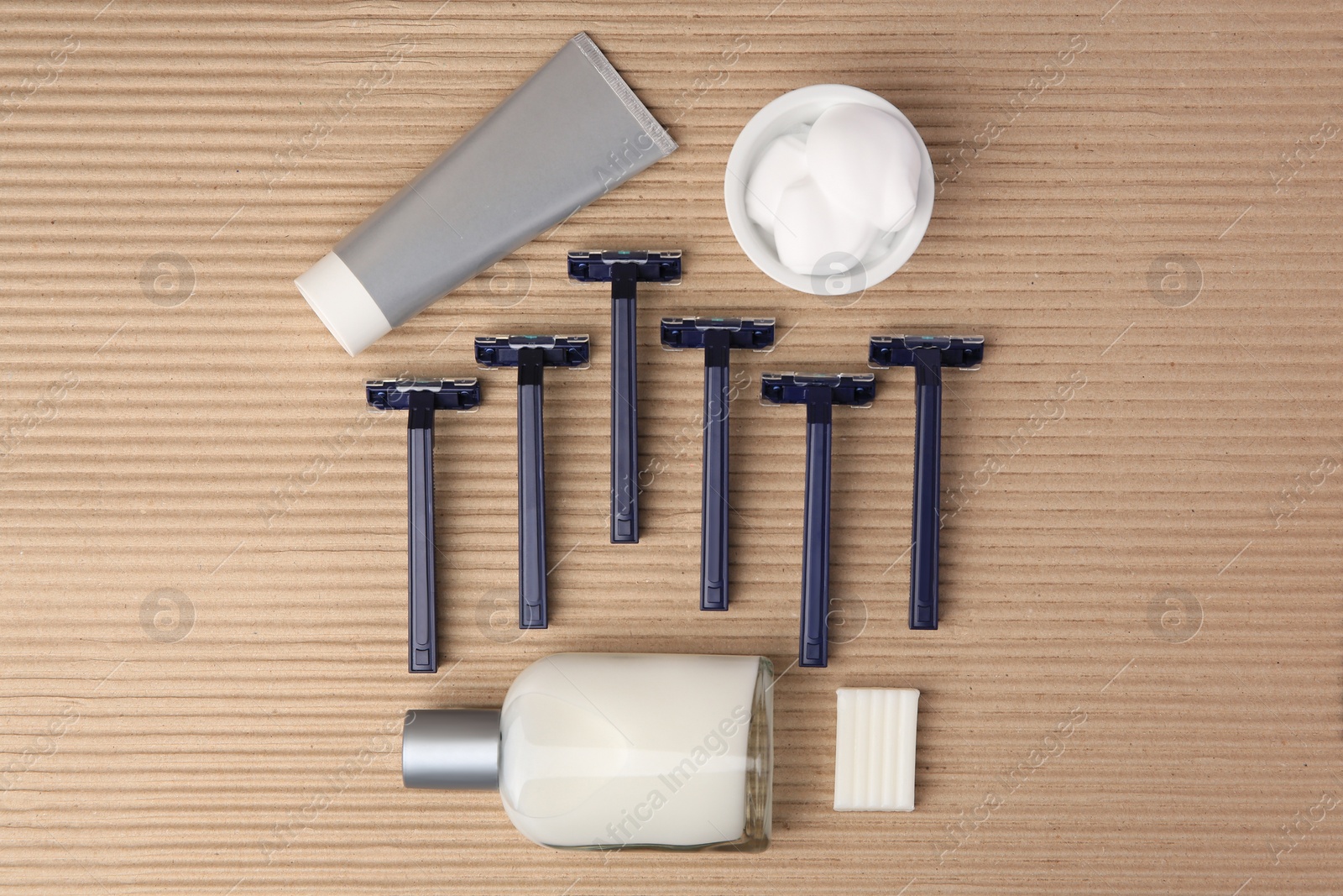 Photo of Flat lay composition with shaving accessories for men on cardboard