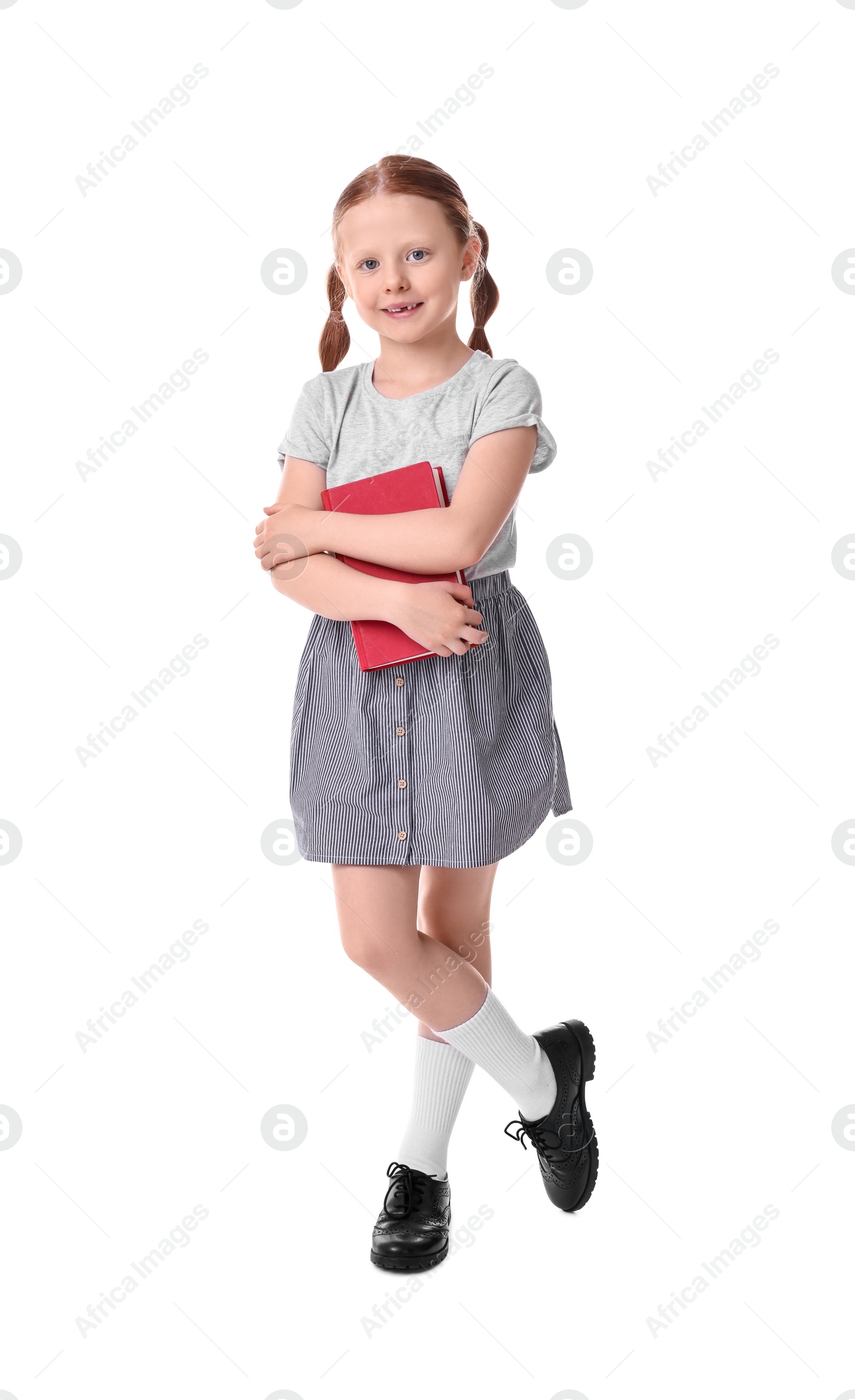 Photo of Smiling girl with book on white background