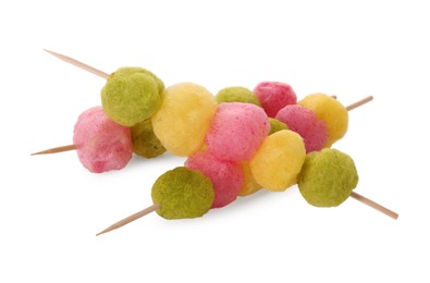 Skewers with color cotton balls isolated on white. Sweet candy