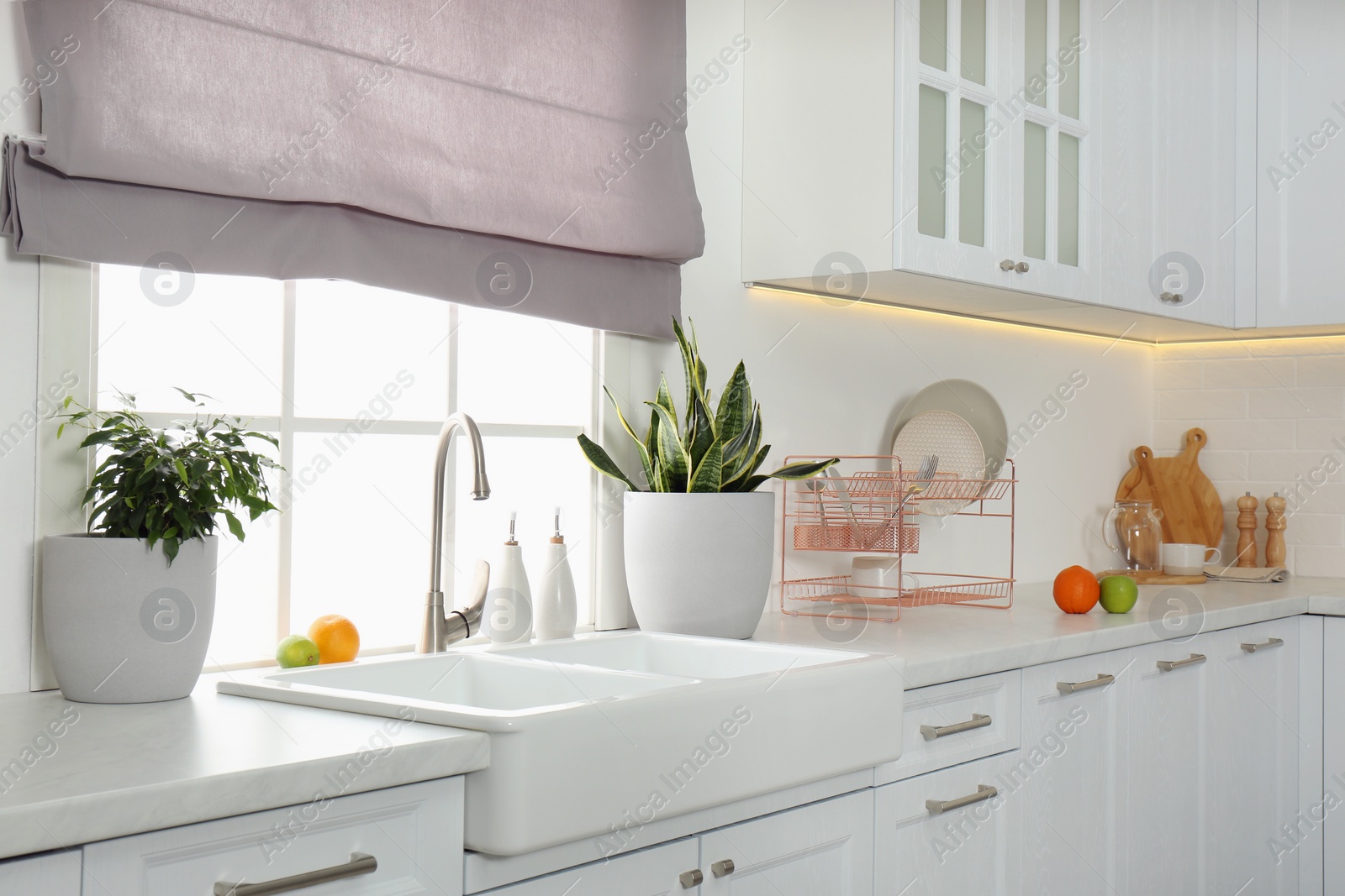 Photo of Beautiful kitchen interior with new stylish furniture