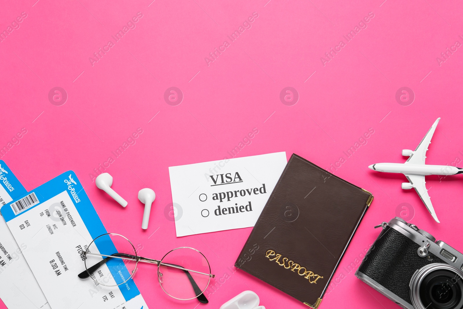 Photo of Flat lay composition with passport and tickets on pink background. Space for text