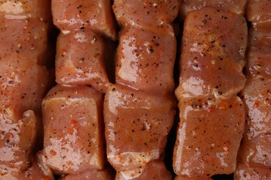 Cut raw marinated meat as background, top view