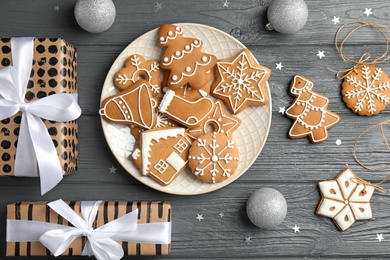 Flat lay composition with tasty homemade Christmas cookies on wooden table