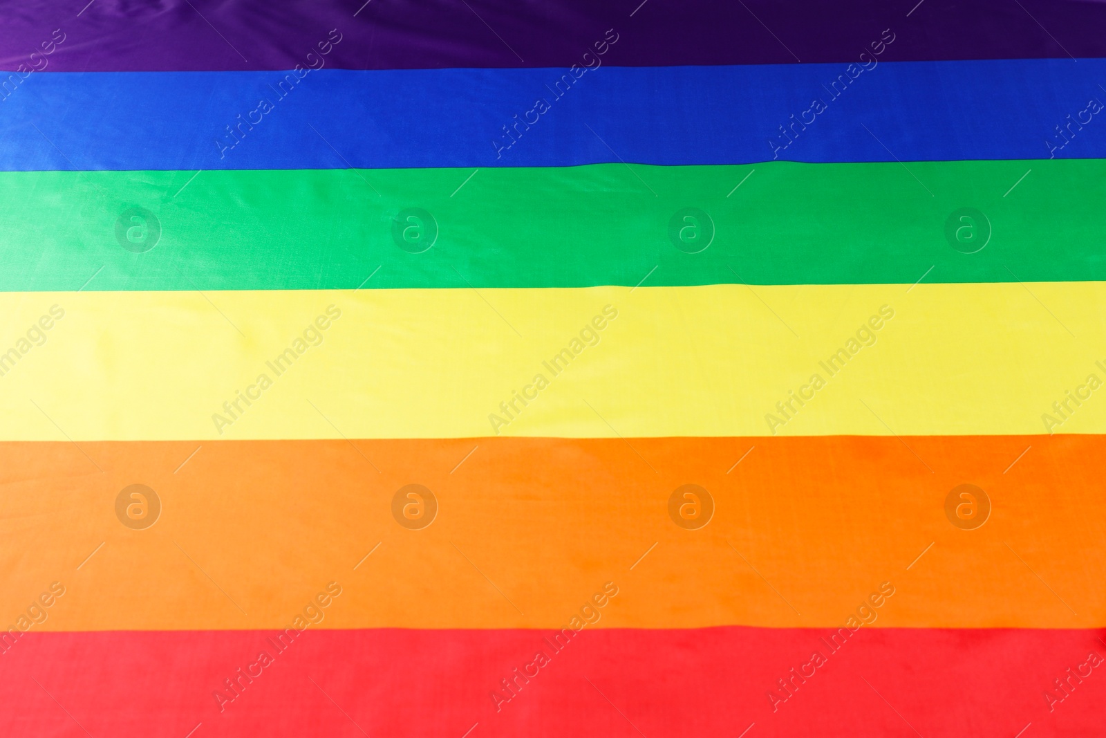 Photo of Rainbow LGBT flag as background, top view