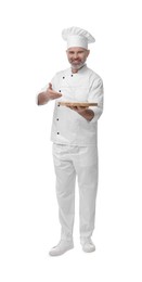 Photo of Happy chef in uniform with wooden board on white background