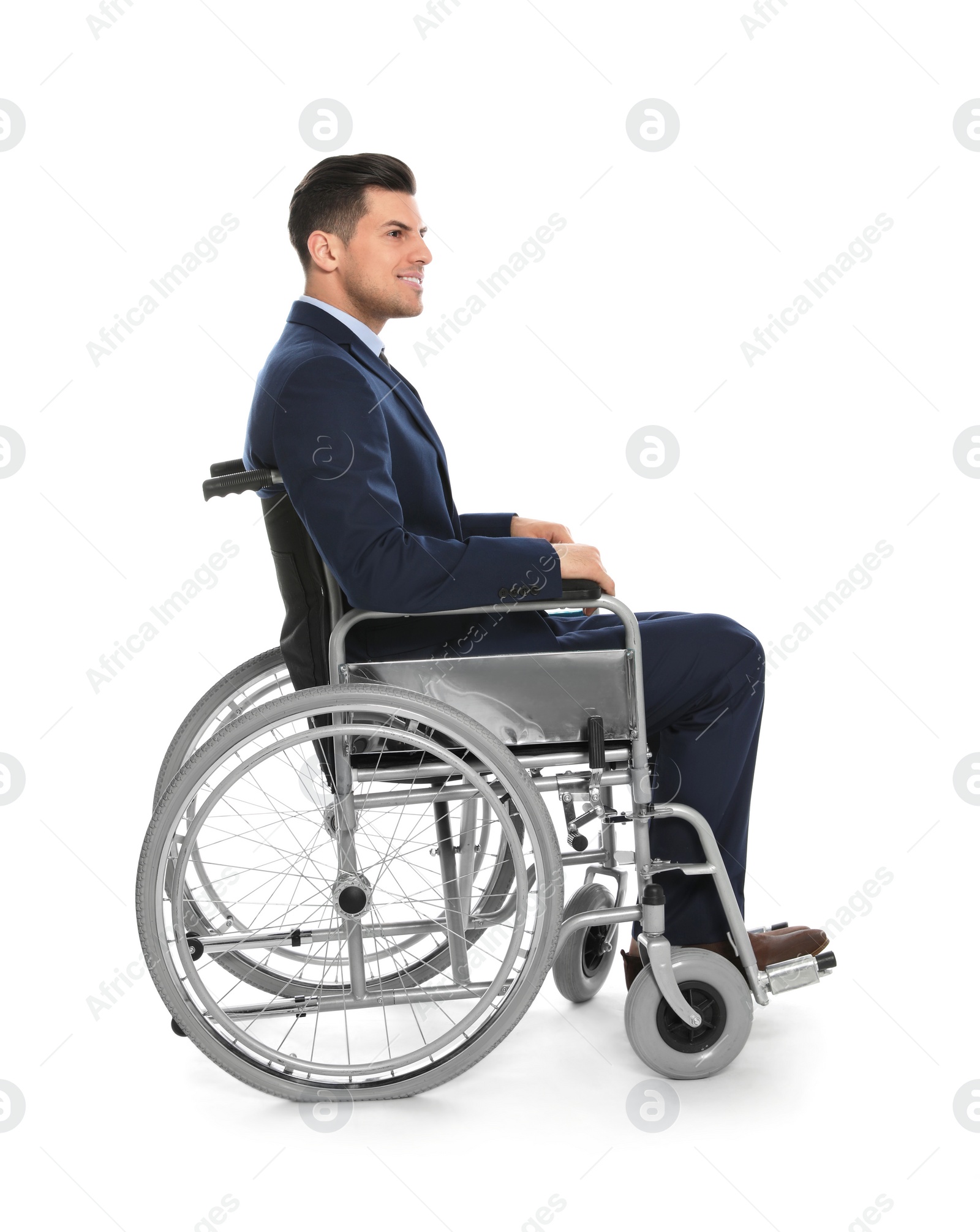 Photo of Handsome young businessman in wheelchair isolated on white