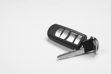 Photo of Car key with alarm system remote control on white background