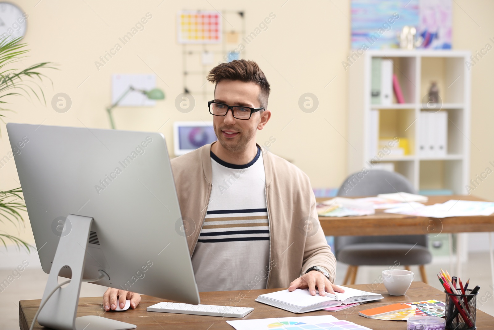 Photo of Professional interior designer at workplace in office