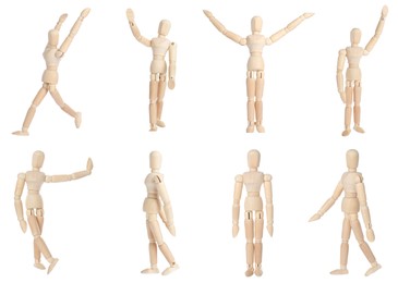 Image of Set with wooden human models in different poses on white background