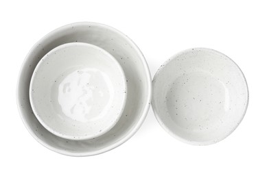 Beautiful empty ceramic bowls on white background, top view