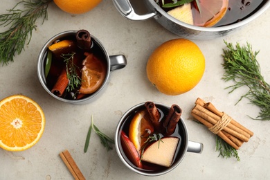 Tasty mulled wine with spices on light table, flat lay