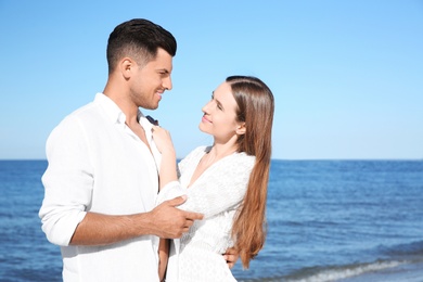 Lovely couple together on beach. Summer vacation