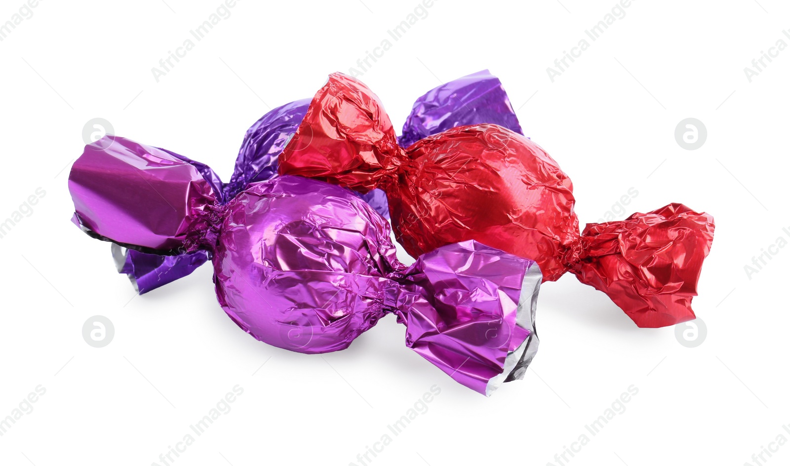 Photo of Tasty candies in colorful wrappers isolated on white